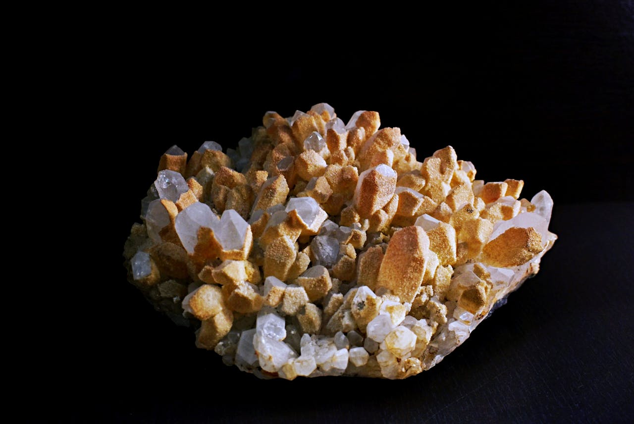 Close-up of a quartz crystal formation exhibiting unique geometric shapes against a dark background.